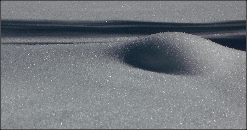 Snow mound and shadow lines