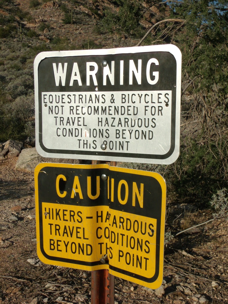 Hikers-Beware sign at entrance of Ford Canyon in White Tank Mountains