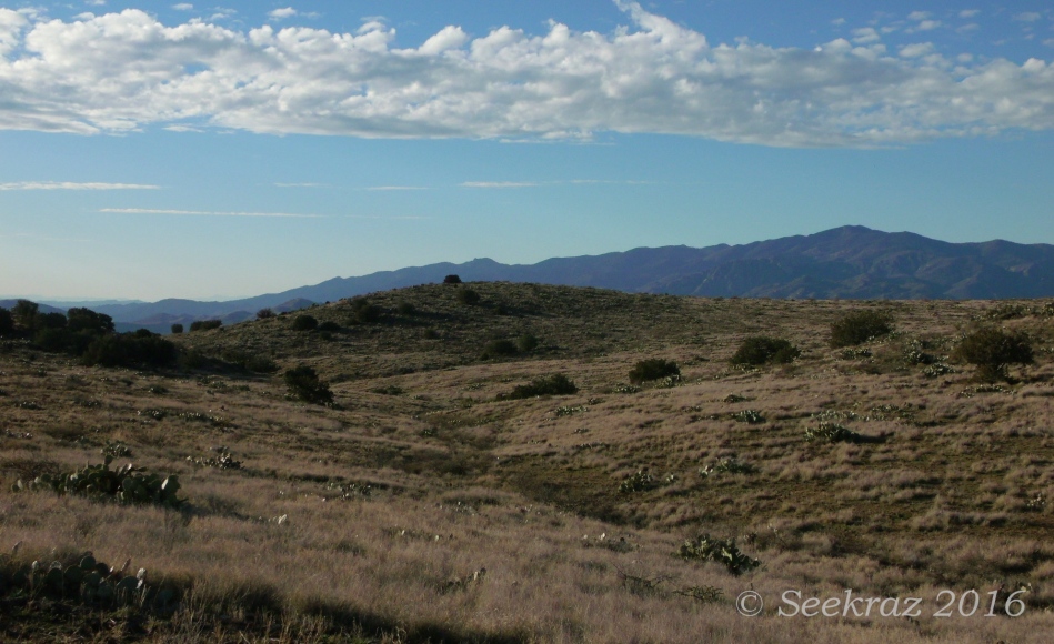Rolling hills, mountains, and clouds along Drinking Snake segment of Black Canyon Trail